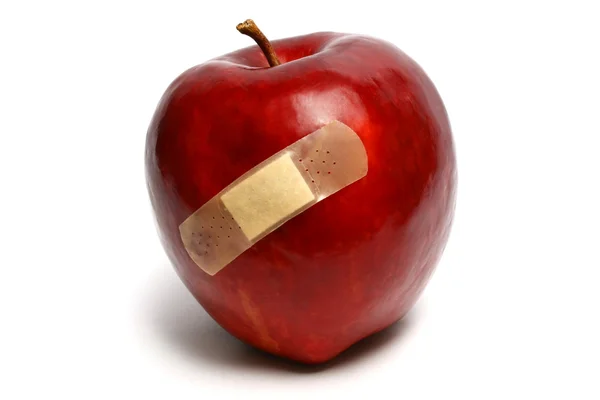 Poškozené červené jablko Stock Fotografie