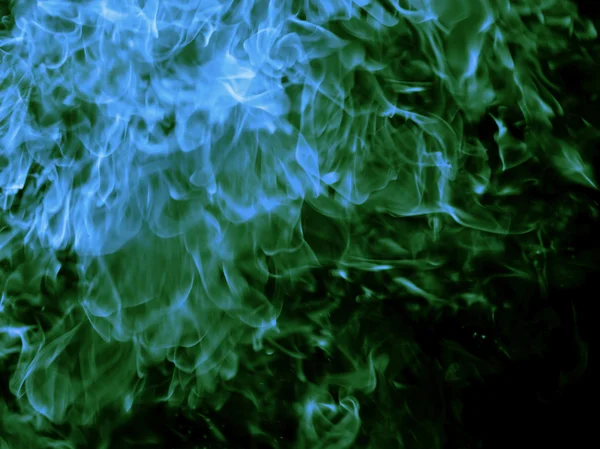 Green fire on black background — Stock Photo, Image