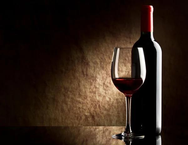Bottle with red wine and glass Stock Image