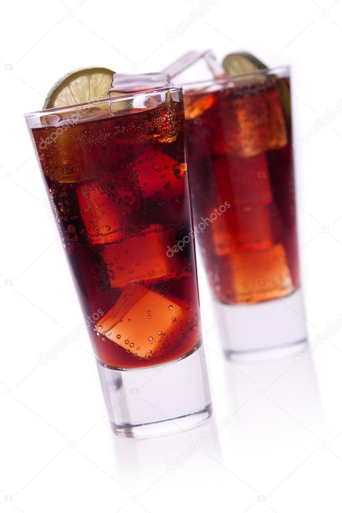 Cocktail with lime and cola on white background