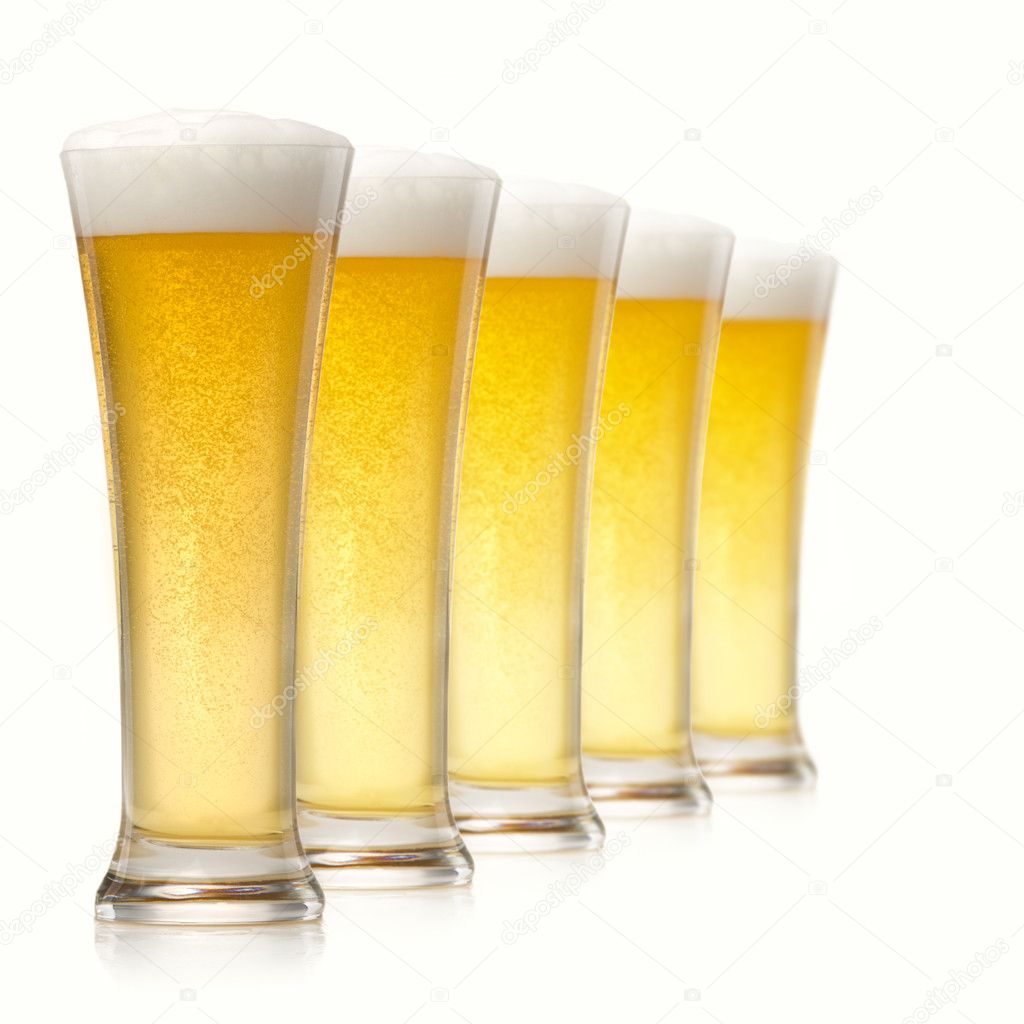 Glasses of beer isolated over white