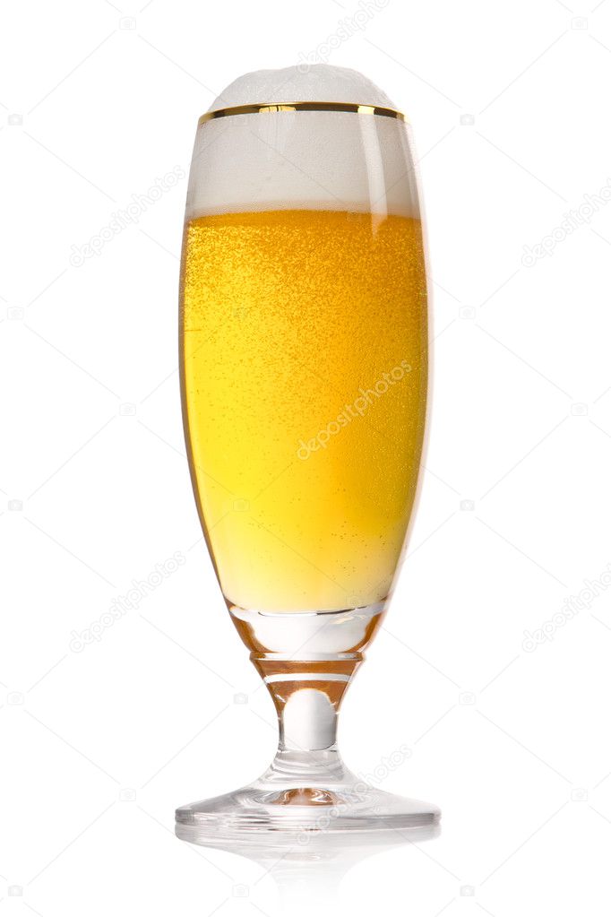 Beer into glass isolated on white