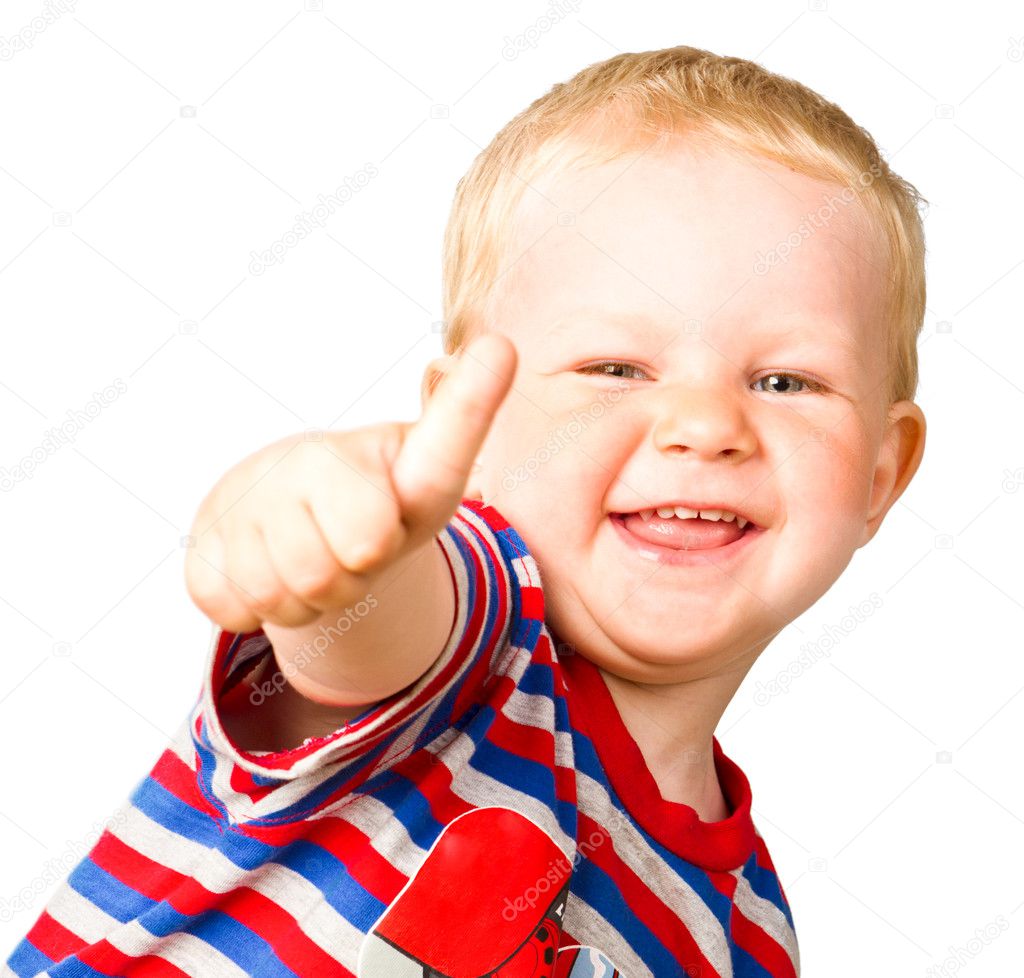 A happy boy is showing thumbs up isolated on the white backgrou