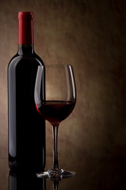 Bottle with red wine and glass and grapes clipart