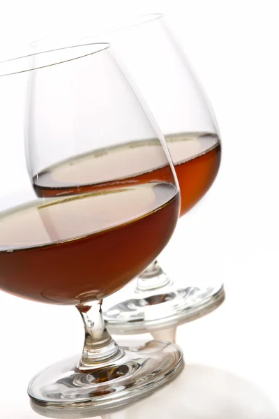 Glass of brandy over white background — Stock Photo, Image