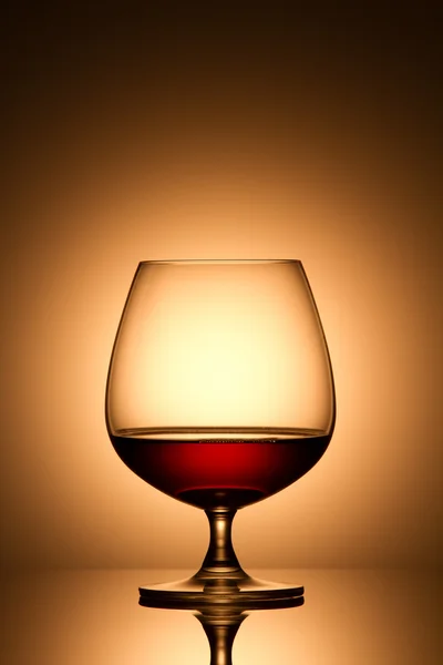 Glass of brandy over white background — Stock Photo, Image