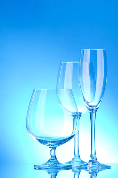 Brilliant glass with a blue background — Stock Photo, Image