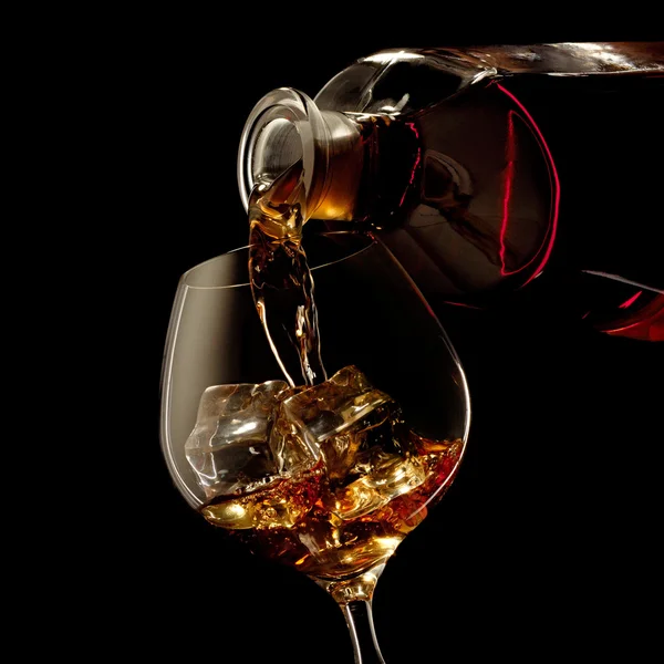 Bicchiere e bottiglia Cognac Immagini Stock Royalty Free