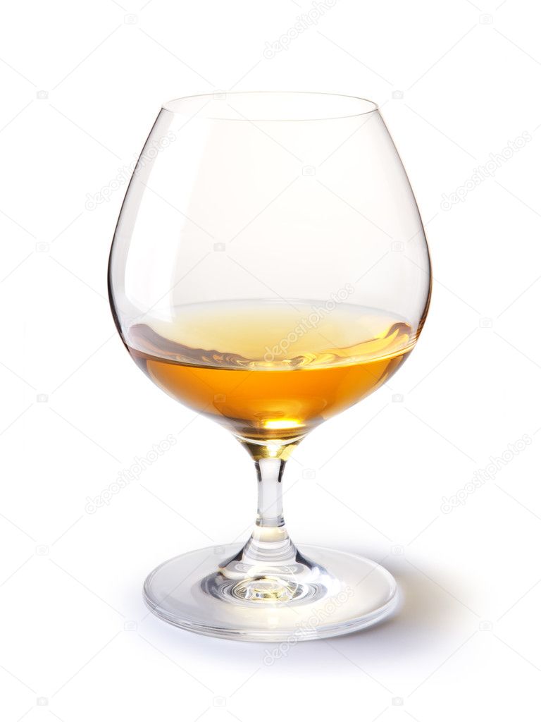 Cognac glass with gold cognac on a white with shadow