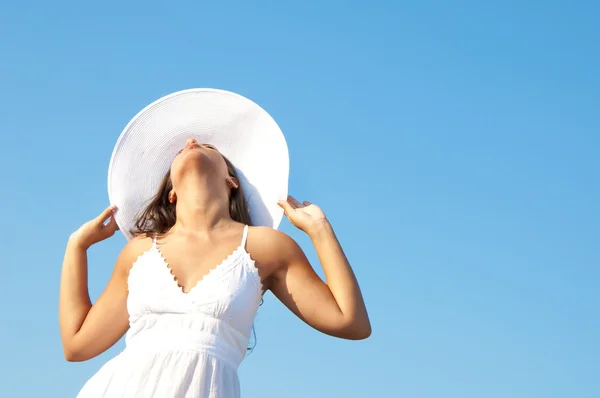 Woman in sky with hat — Stock Photo, Image