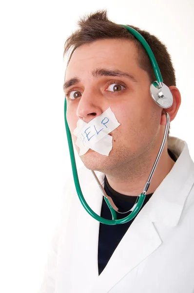 Grappige arts met een stethoscoop vragen de hulp — Stockfoto