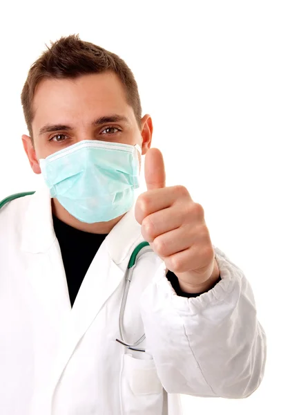 Молодой доктор с большими пальцами на белом фоне — стоковое фото