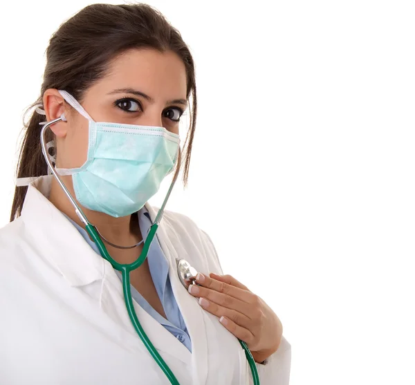 Junger Arzt mit Stethoskop auf weißem Hintergrund — Stockfoto