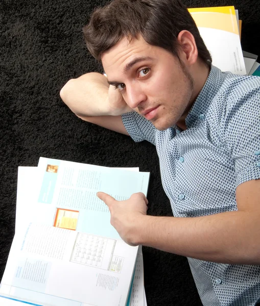 Student man with his book in camera — Stock Photo, Image