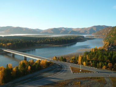 Bridge through river Abakan clipart