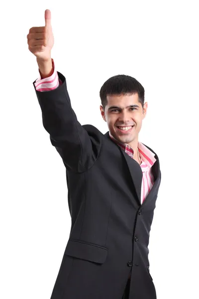 Felice giovane uomo in un abito da lavoro mostrando pollice in su — Foto Stock