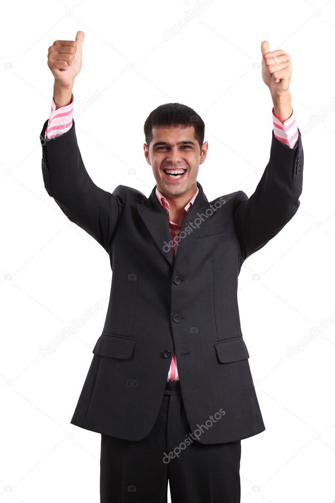 Happy young man in a business suit showing thumbs up