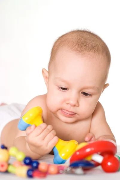 Bom bebê com brinquedos — Fotografia de Stock