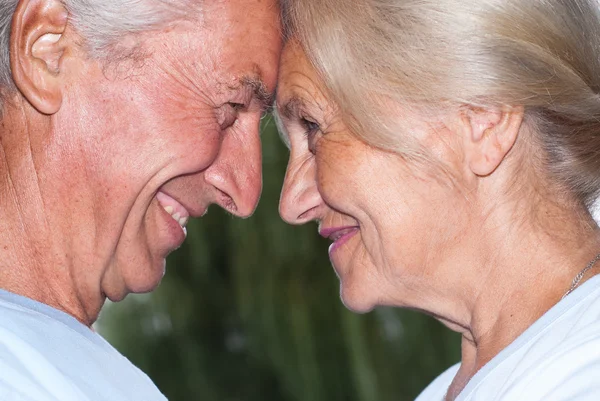 Aged couple smiling — Stok fotoğraf