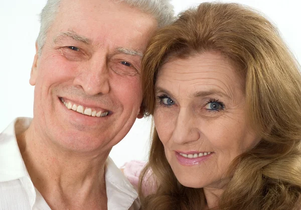 Happy elderly couple on a white — Stock Photo, Image