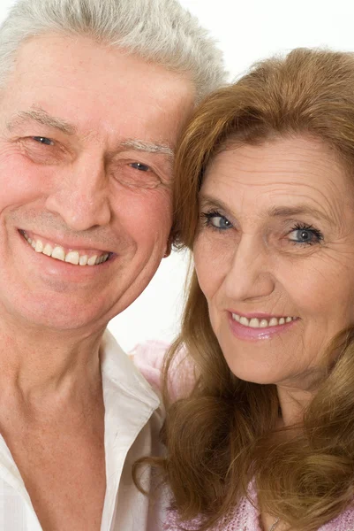 Happy elderly couple on a white — Stock Photo, Image