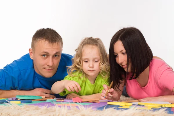 Familie op het tapijt — Stockfoto
