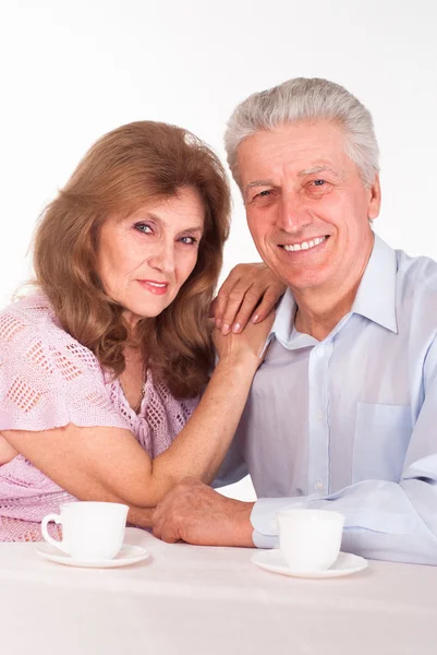 Bejaarde echtpaar op een wit — Stockfoto