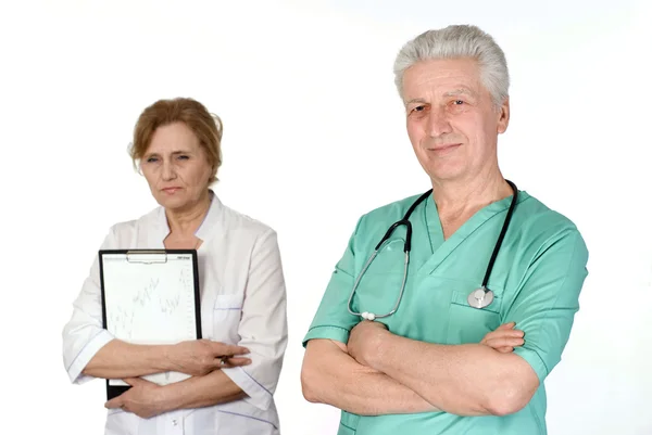 Два старших лікаря на білому — стокове фото