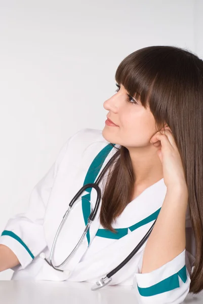 Piękne pielęgniarki siedzi — Zdjęcie stockowe