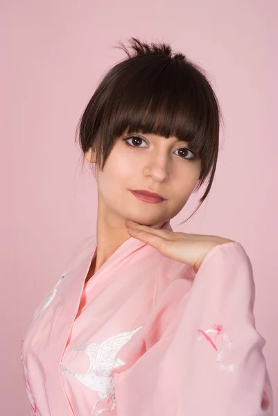 Girl standing on a pink — Stock Photo, Image
