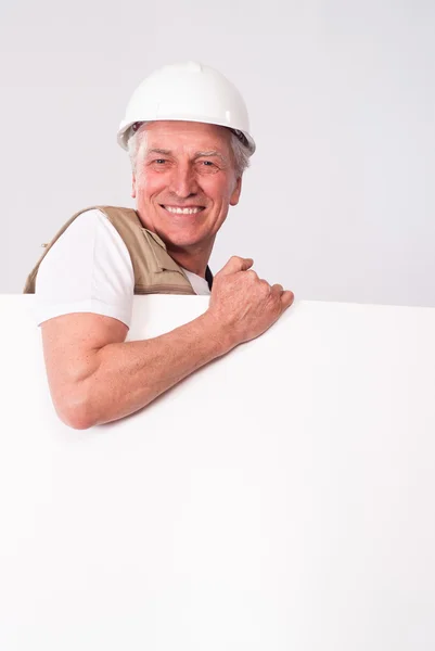 Senior bouwer in helm — Stockfoto