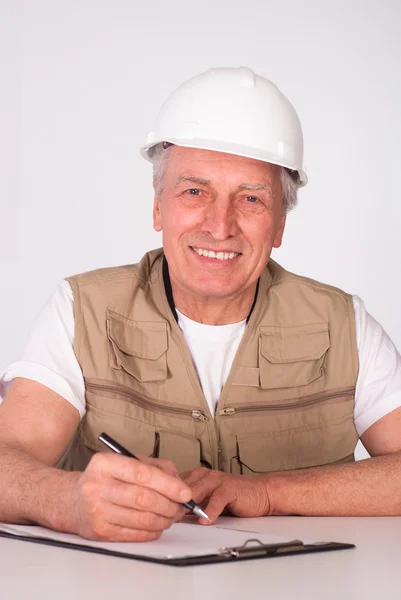 Senior builder sitting — Stock Photo, Image