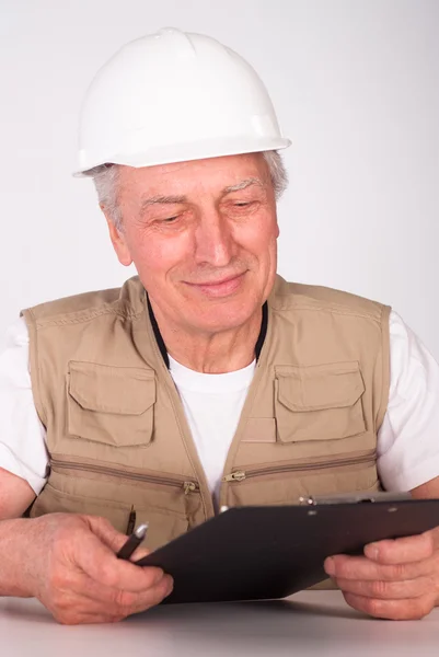 Senior bouwer zitten — Stockfoto