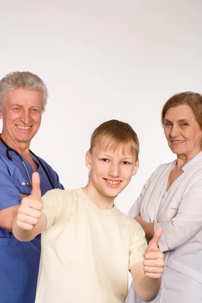 Two doctors and kid — Stock Photo, Image
