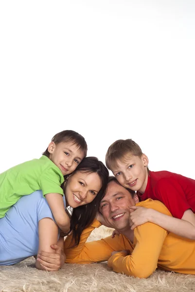Família próspera em um carpete — Fotografia de Stock