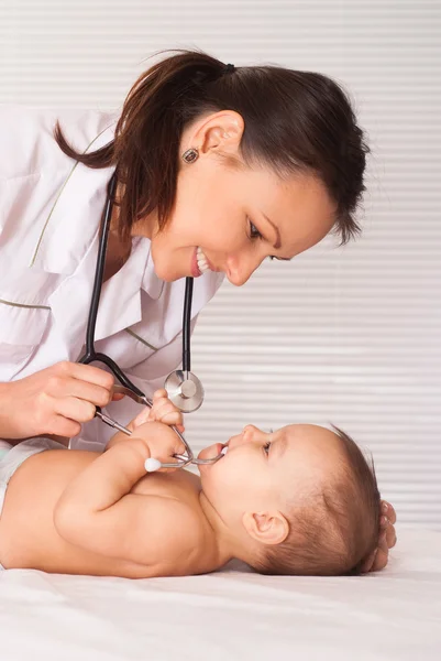 Young doctor with baby Royalty Free Stock Images