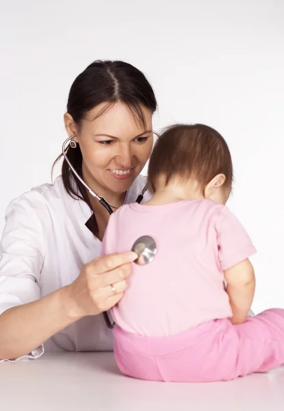Doctor with small patient Royalty Free Stock Images