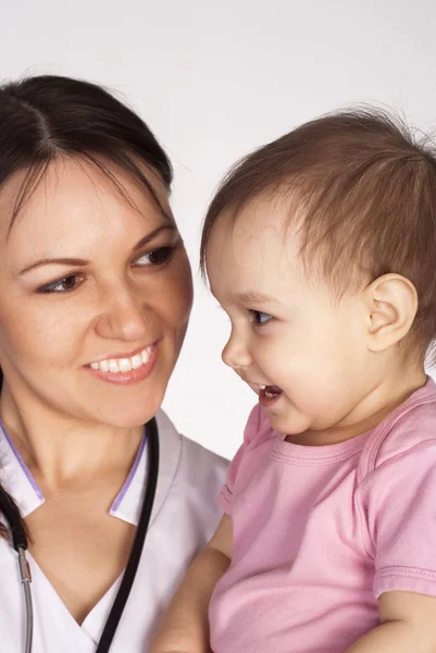 Doctor with small patient Stock Image