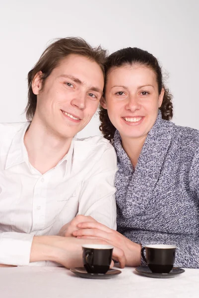 Young couple at the table — Stock Photo, Image