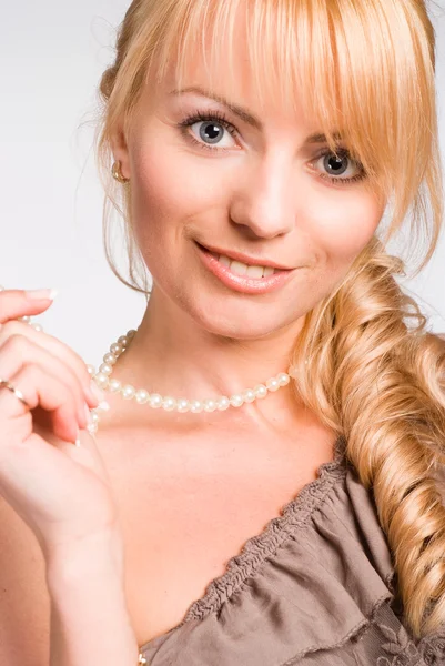 Girl with beads — Stock Photo, Image