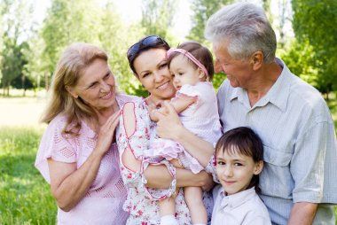 Happy family at nature clipart