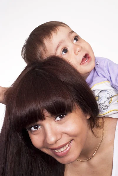 Portræt af en mor med barn - Stock-foto