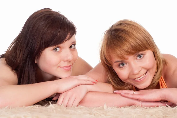 Young girls on carpet — Stock Photo, Image