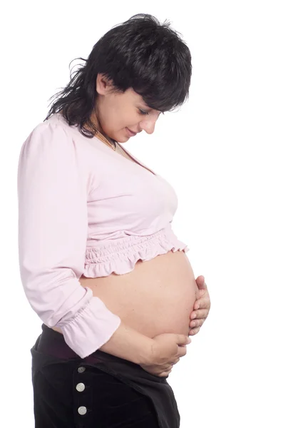 Беременная женщина позирует — стоковое фото