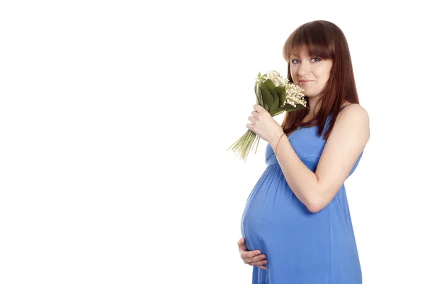 Chica embarazada con flores — Foto de Stock