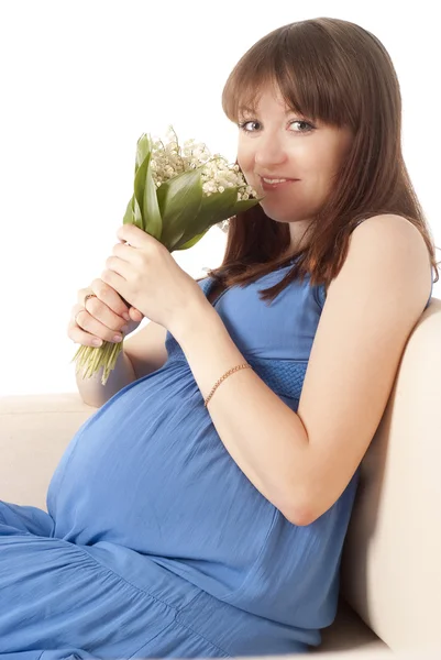 Pregnant girl with flowers — Stock Photo, Image