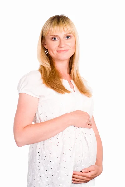 Беременная женщина в белом — стоковое фото