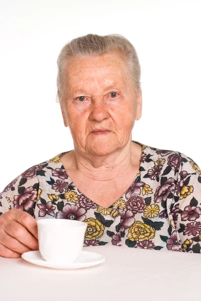 Granny at table — Stock Photo, Image