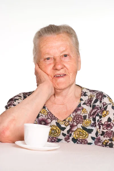 Oma am Tisch — Stockfoto