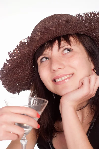 Girl in hat drinks — Zdjęcie stockowe